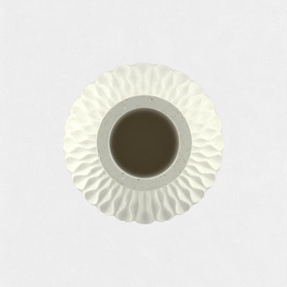 Decorative vase with wavy relief